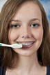 Beautiful Teenage Woman Brushing Teeth