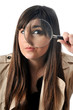 Photo: a beautiful girl holds a magnifying lens a beautiful girl holds a magnifying lens
