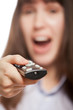 Woman hand holding tv channel remote control
