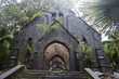 Ruin of abandoned church covered with roots on Ross Island