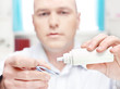 Photo: man clean contact lens at home man clean contact lens at home