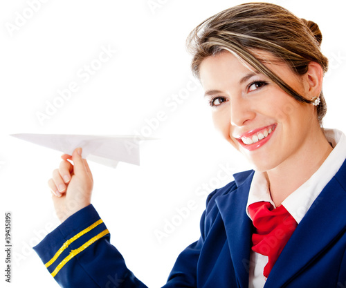 Photo: Flight attendant with a paper airplane Flight attendant with a paper airplane