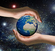 hands of women and the globe