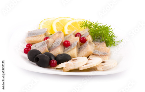 Photo: Testy cut herring with vegetable on the plate Testy cut herring with vegetable on the plate