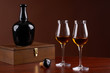 Photo: composition with bottle and glass of brandy composition with bottle and glass of brandy