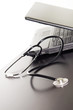 Computer and stethoscope on the table. Computer and stethoscope on the table.