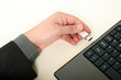 Hand holding usb thumb drive