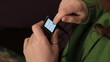 Redheaded woman uses an mp3 player