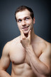 Muscles or brain? Muscular man thinking Muscles or brain? Muscular man thinking