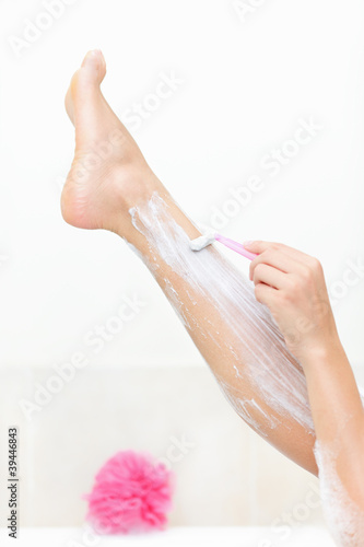 Photo: Woman shaving legs Woman shaving legs