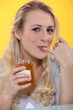 Woman tasting honey