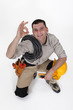 An electrician doing an ok sign.