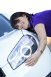 .Woman embracing her new car