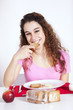 .Young woman eating toast