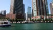 Chicago boat on river with buildings