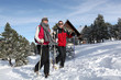 Couple trekking through snow