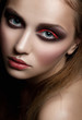 Woman with bright fashion makeup