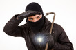Thief with flashlight and crowbar, isolated in white