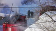 Firefighters extinguish a fire in the pit