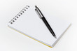 Notepad with pen isolated on white background Notepad with pen isolated on white background