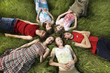 Group of Teens lying on the meadow, Close to each other