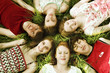 Group of Teens lying on the meadow, Close to each other
