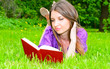 young woman reading on the grass