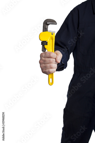 Photo: handyman holding an adjustable pipe wrench handyman holding an adjustable pipe wrench