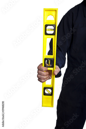 Photo: man holding a yellow bubble level man holding a yellow bubble level