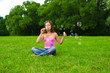 girl blowing soap bubbles