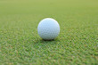 Photo: Golf ball on green grass Golf ball on green grass