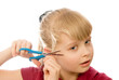 child cuts his hair