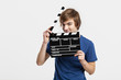 Holding a clapboard