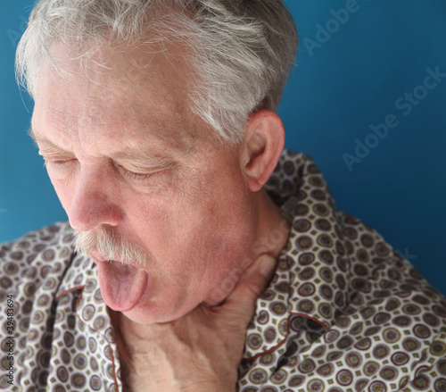 Photo: ill senior man coughing ill senior man coughing