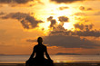 Man silhouette doing yoga exercise
