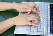 Female hands on the keys typing documents