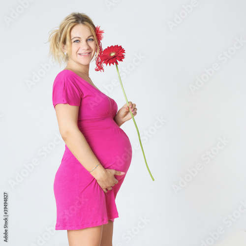 Photo: Pregnant Woman with Flower Pregnant Woman with Flower