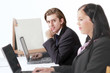 Photo: Man in business meeting with colleague in foreground Man in business meeting with colleague in foreground