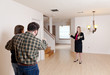 Photo: Realtor shows empty home to prospective buyers Realtor shows empty home to prospective buyers
