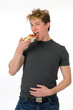 Young man eating pizza