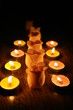 Candles and buds of roses