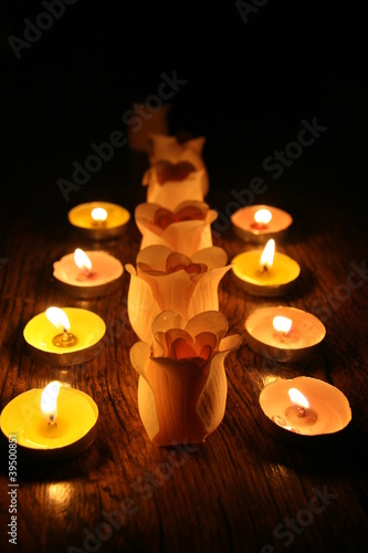 Photo: Candles and buds of roses Candles and buds of roses
