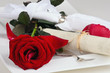 Romantic place setting with red rose and card to label