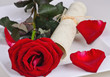 Romantic place setting with red rose and card to label