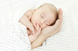 Newborn baby sleeping on parents hand Newborn baby sleeping on parents hand