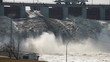 Spring flood water flowing on hydroelectric power station dam Spring flood water flowing on hydroelectric power station dam