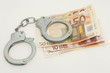 Geld und Handschellen