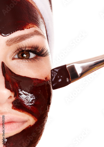 Photo: Girl having chocolate facial mask. Girl having chocolate facial mask.