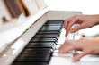 Playing Piano (shallow DOF; color toned image)