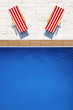 swimming pool with two beach chairs